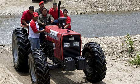 Hugo Chavez drives a tractor during his weekly broadcast, Alo Presidente, in the state of Aragua.
