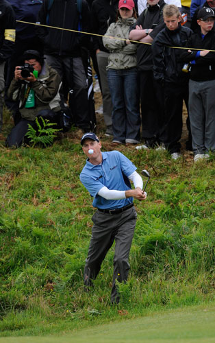 Open Golf Day 2: Jim Furyk fluffs his chip onto the 5th green and puts it into a bunker