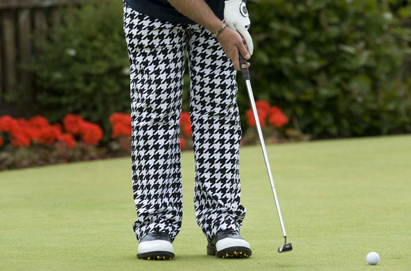 Tom Jenkins Open golf: John Daly practices on the putting green wearing houndstooth check trousers