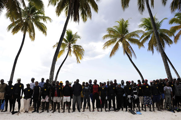 Yemenia airways update: Divers wait by temporary emergency camp set up in the north of the Comoros