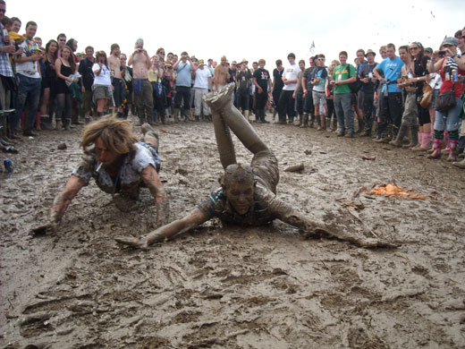 Glasto: Mud sliders at Glastonbury 2009