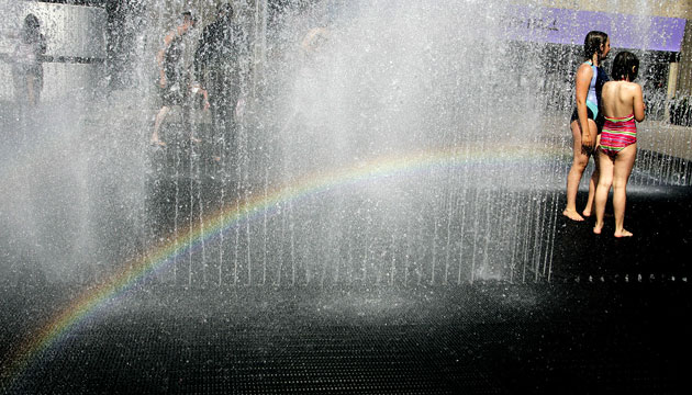 Heatwave: Children play in a fountain on the South Bank of the Thames in London