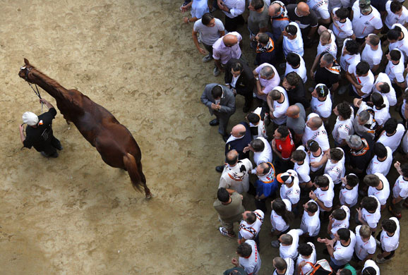 24hours in pictures: Palio horse race on Piazza del Campo Tuscany