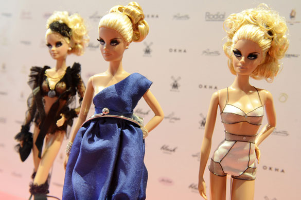 24hours in pictures: Barbie dolls wearing outfits created by various fashion designers