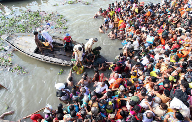 eclipse: attempted rescue of devotees from the Ganges in Varanasi during eclipe