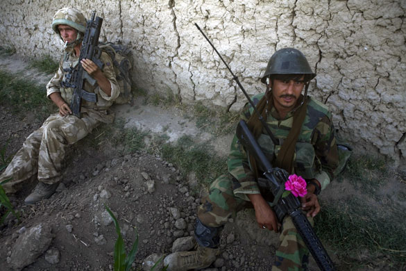 Sean Smith Helmand: A British soldier, left, part of an OMLT, with an Afghan soldier