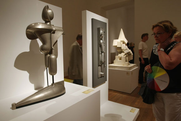 Bauhaus exhibition: A visitor looks at the sculpture Abstract Figure by Oskar Schlemmer