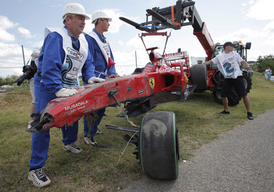 Budapest qualifying: The wreck of Massa's Ferrari is taken away following his accident