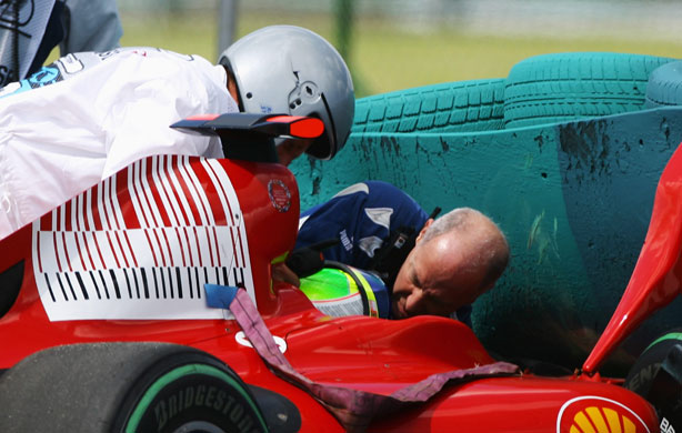 Budapest qualifying: Felipe Massa is attended to by Gary Hartstein, medical staff and marshalls