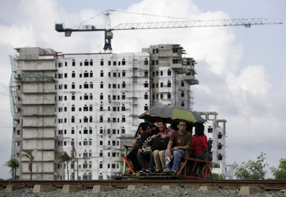 26 July 2009: Manila, Philippines: Commuters ride in a makeshift trolley