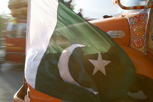 Swat: A Pakistani flag flies from a truck carrying people and supplies