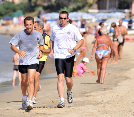 Nicolas Sarkozy: 3 August 2008: Nicolas Sarkozy runs on the beach during his holidays