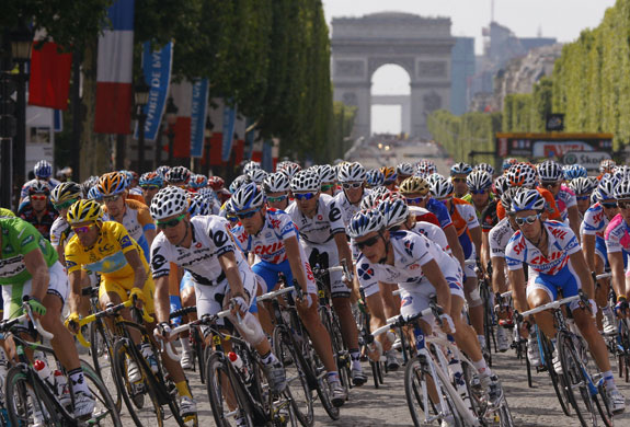 Tour de France: Paris: Alberto Contador rides with the pack down the Champs-Elysees