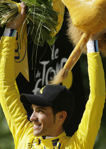 Tour de France Paris: Alberto Contador, wearing the overall leader's yellow jersey, on the podium