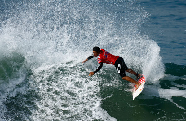 Hurley US Open of Surfing: Adriano de Souza of Brazil competes in the men's quarter final