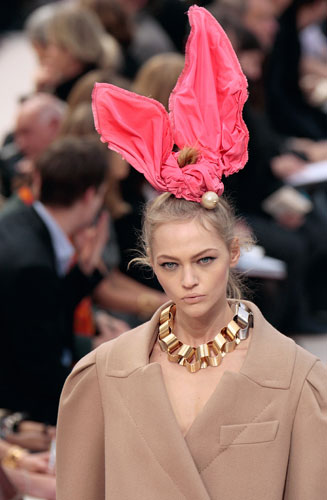 Look The Business: A model wears a chunky gold Vuitton necklace