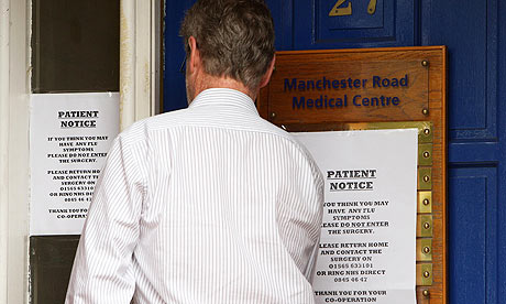 A swine flu advice notice on the door of a health centre