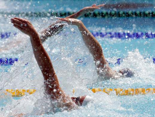 FINA World Championship: Competitors swim in a heat of the Men's 100M Backstroke