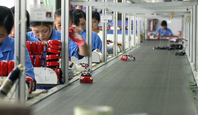 Coal in China: Workers assemble toys on a production line at factory, Guangdong, China