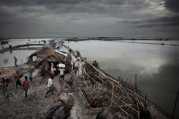 Bangladesh flood defences: Thousands lives on the embarkments surrounding the island Padma Pakur
