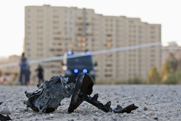 24 hours: Debris lies on the road after a car bomb explosion in Burgos