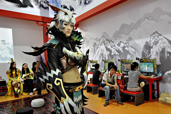 China Digital Expo: A video game character stands at a booth