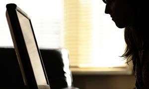 Woman looking at a computer screen