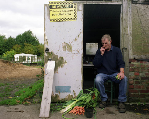 Manchester East 1 - 10: A man sits by his allotment