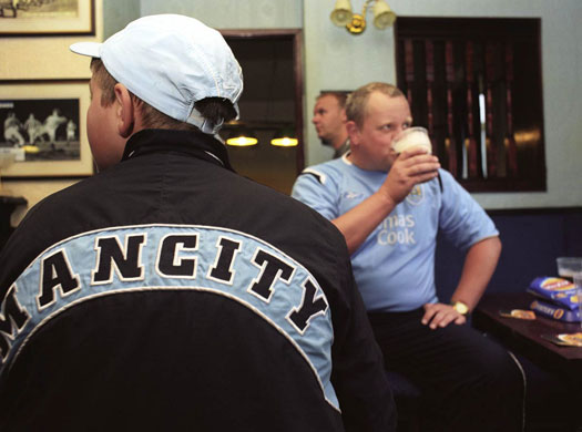 Manchester East 1 - 10: Three men sit drinking in a pub