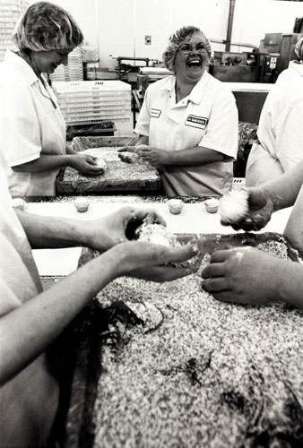 Manchester East 1 - 10: Women at Greggs bakery laugh as they ice cakes