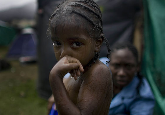 24 hours in pictures: Bogota, Colombia: girl in a makeshift camp for internally displaced people