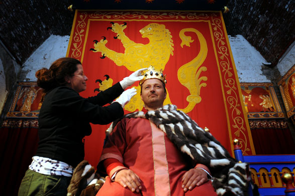 Dover Castle: English Heritage custodian Joanne Gray trying the crown on Darren Ormandy