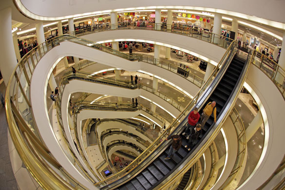 Week in Business: Shoppers make their way down an escalator at the San Francisco Centre