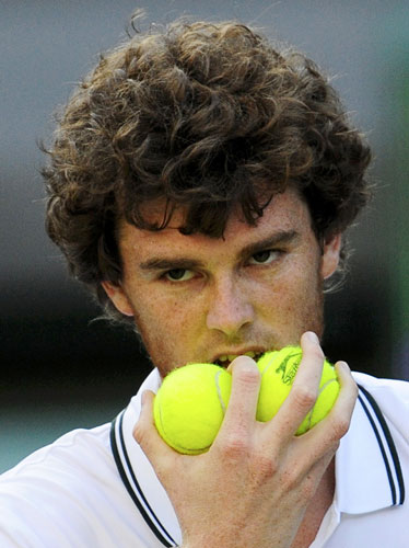 24 hours in sport: Jamie Murray of Britain holds tennis balls