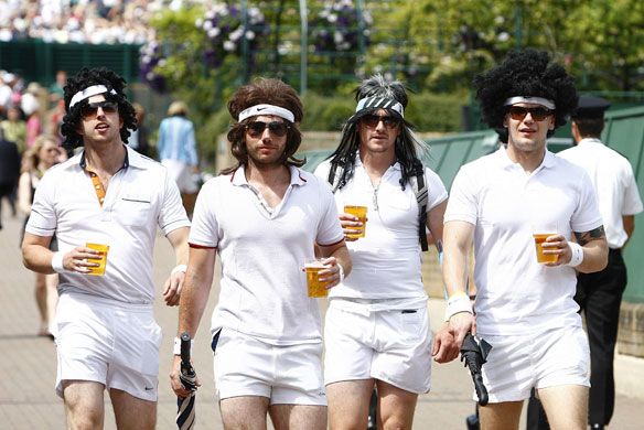 Wimbledon: Day 12: Wimbledon 2009 Day 12 fans dressed up and carrying drinks on way to a match