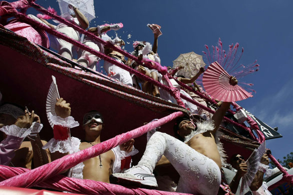 24 hours in pictures: Madrid, Spain: Revellers dance as they take part in a Gay Pride parade