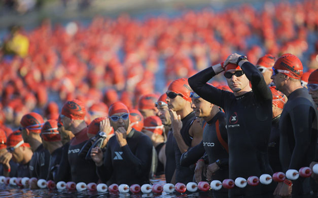 24 hours in pictures: Frankfurt, Germany: Ironman athletes at the start of the swimming section
