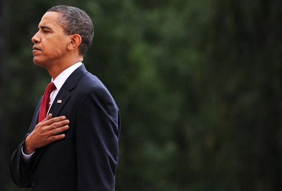 Obama in Russia: US President Barack Obama stands with his hand over his heart 