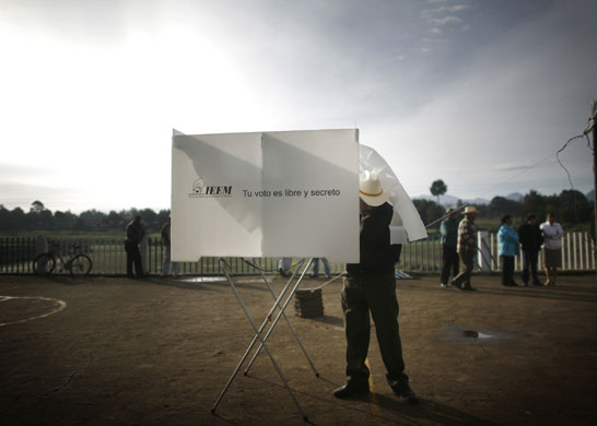 24 hours in pictures: A man casts his vote during elections in Mexico city