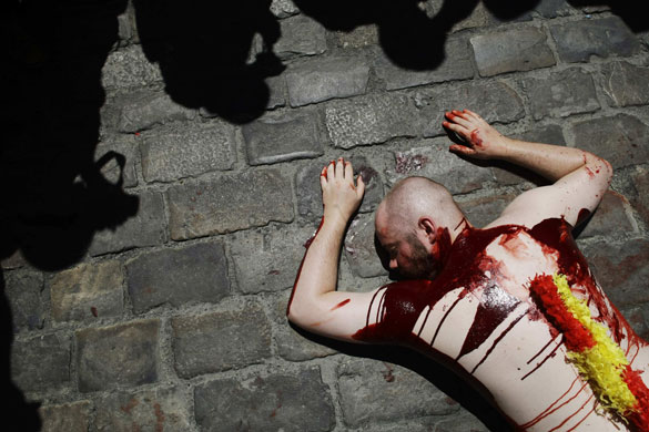24 hours in pictures: A protester against bullfighting before the San Fermin festival