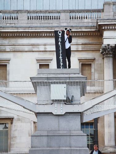 Plinth Trafalgar Square: Suren Seneviratne stands on the empty fourth plinth with his mobile phone