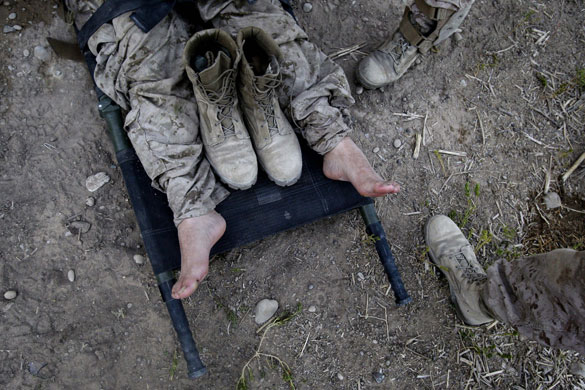 24 hours in pictures: A U.S. Marine lies on a stretcher Afghanistan