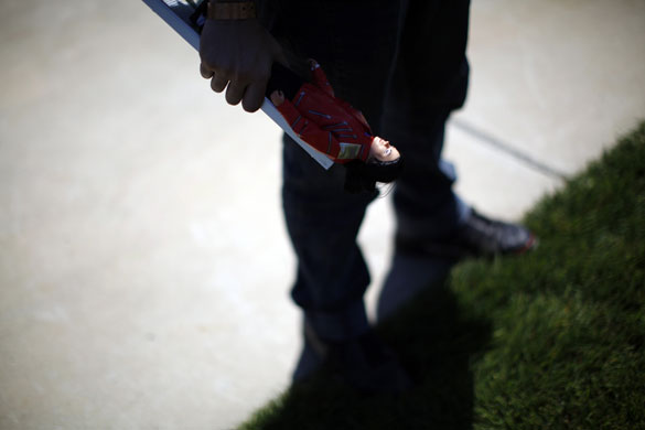 24 hours in pictures: Michael Jackson fan holds memorabilia in Los Angeles