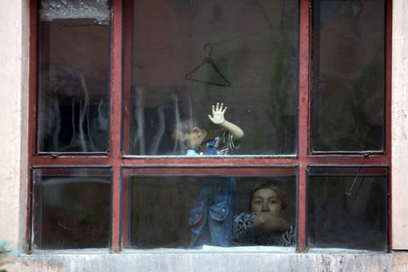 24 hours in pictures: Uighur woman