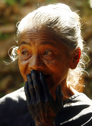 24 hours in pictures: A Kajang tribeswoman waits to vote