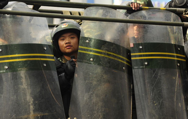 24 hours in pictures: Chinese riot soldiers