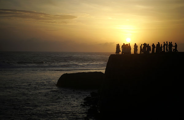 24 hours in pictures: People gather as the sun sets in Galle