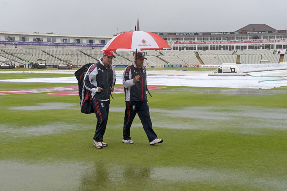 Toms Ashes Day 3: Andrew Strauss and Andy Flower walk over the flooded outfield 