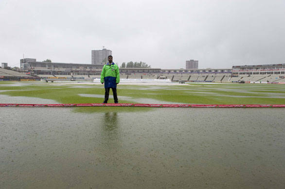 Toms Ashes Day 3: A steward stands on the flooded pitch