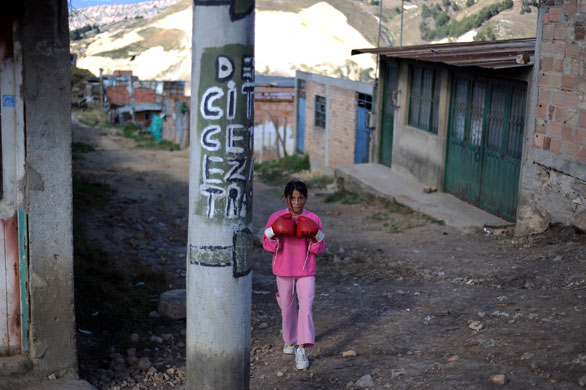 10 August 2009: Soacha, Colombia: A girl walks through the streets of Altos de la Florida